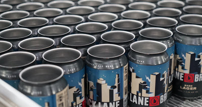 Base Lager cans out the door